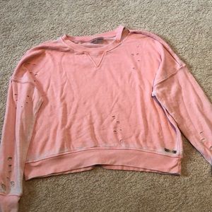 pink ripped sweatshirt